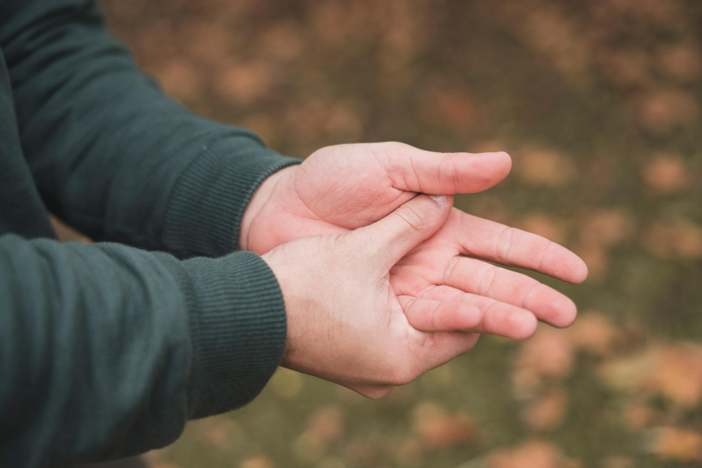 Man massaging his hand