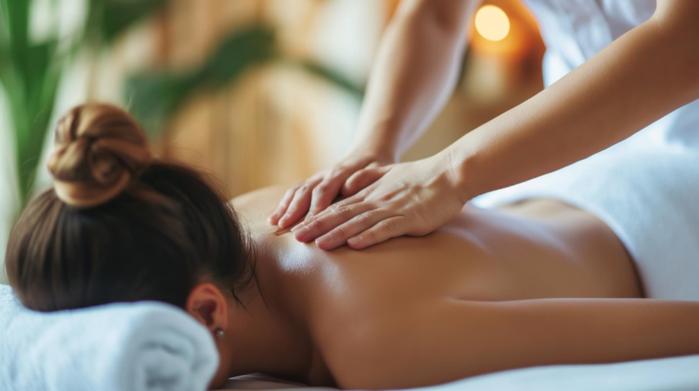 Woman getting back massage at spa