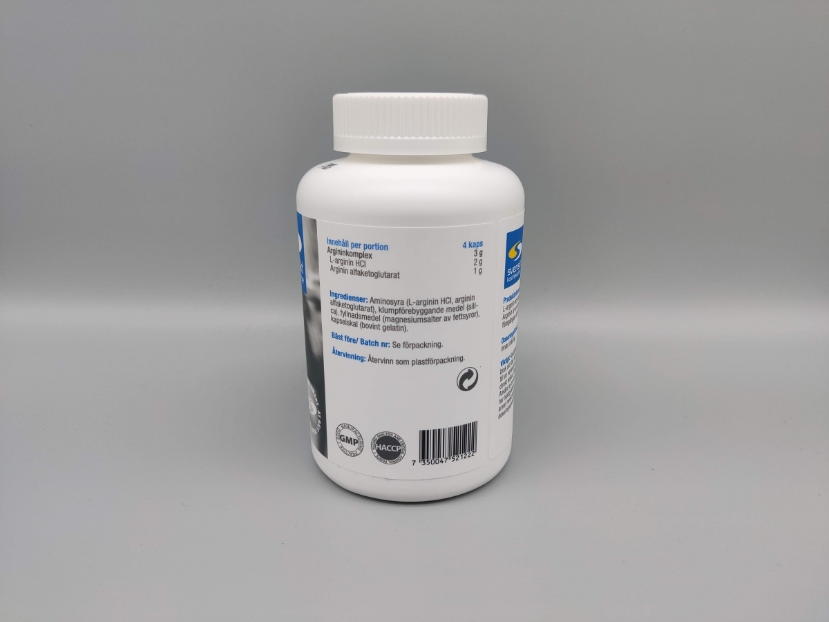 Närbild av innehållsetikett och dosering på Core Arginine Complex