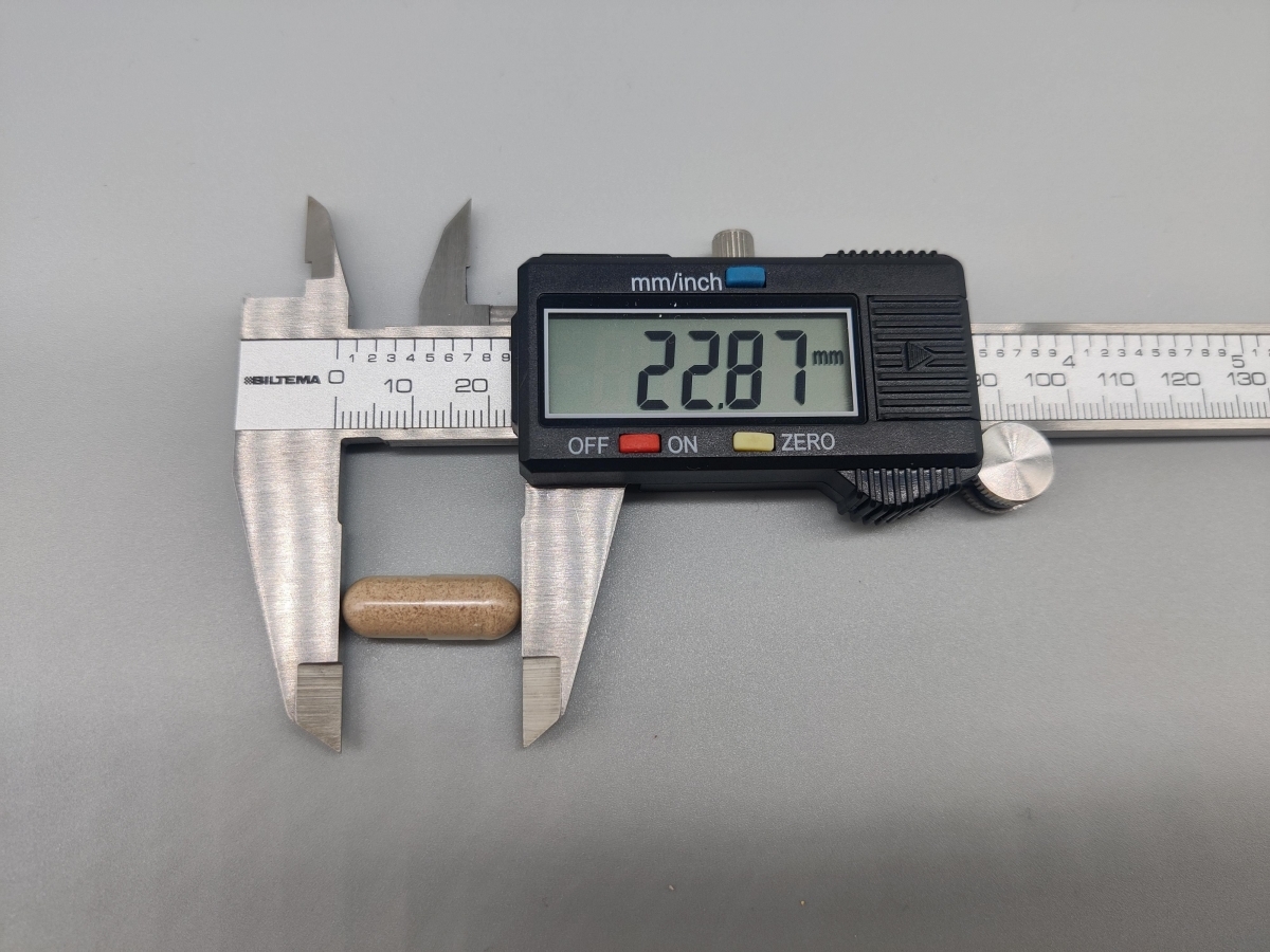 Kapsel från Core Joints uppmätt med skjutmått 22,87 mm dokumenterat av oss