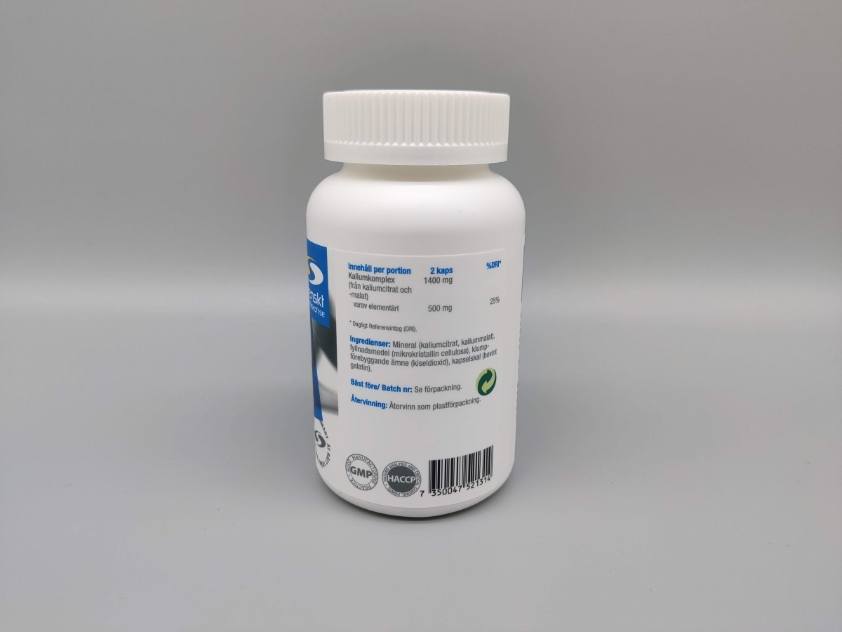 Etikettens baksida visar 2 kapslar per portion med 500 mg elementärt kalium