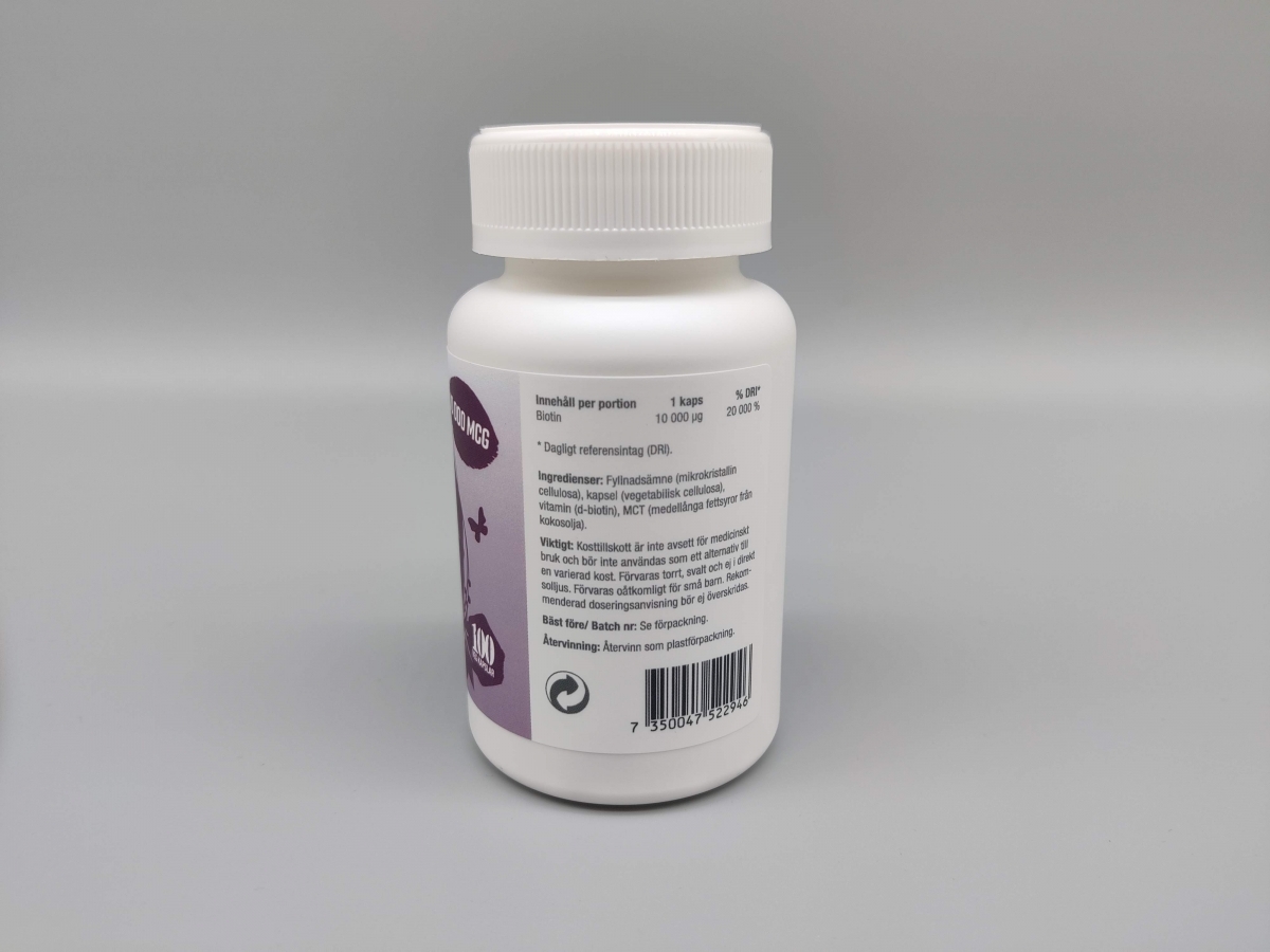 Baksida av Healthwell Biotin med ingredienslista och dos 10 000 µg