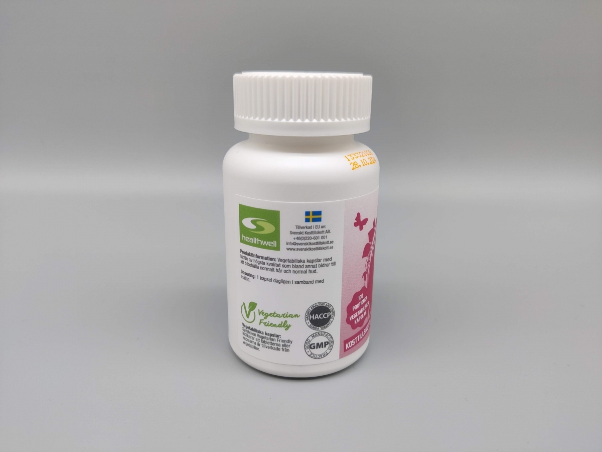 Healthwell Biotin 500 med kvalitetsmärkningar och svensk återförsäljare angiven, foto taget av oss