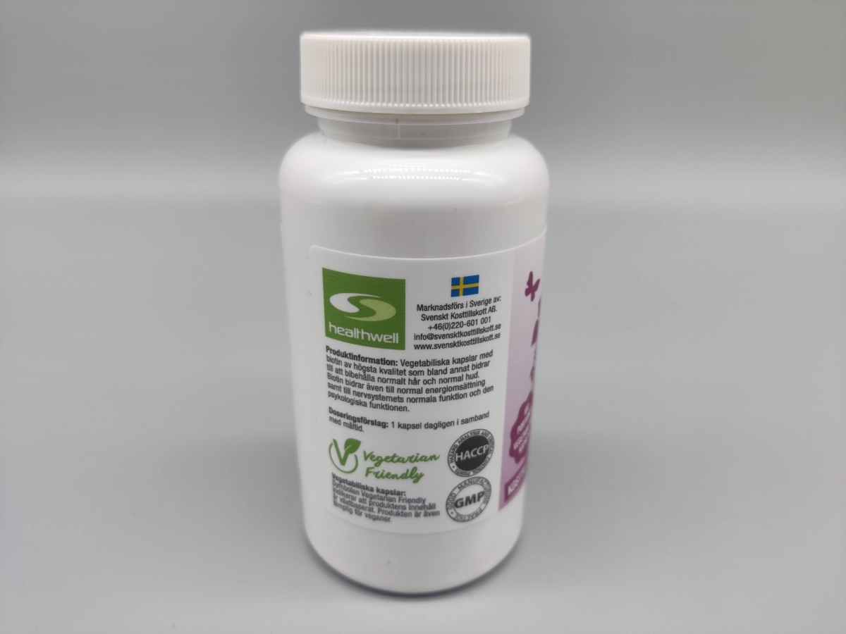 Baksida av Healthwell Biotin 5000 med Vegetarian Friendly och kvalitetsmärkningar foto av oss