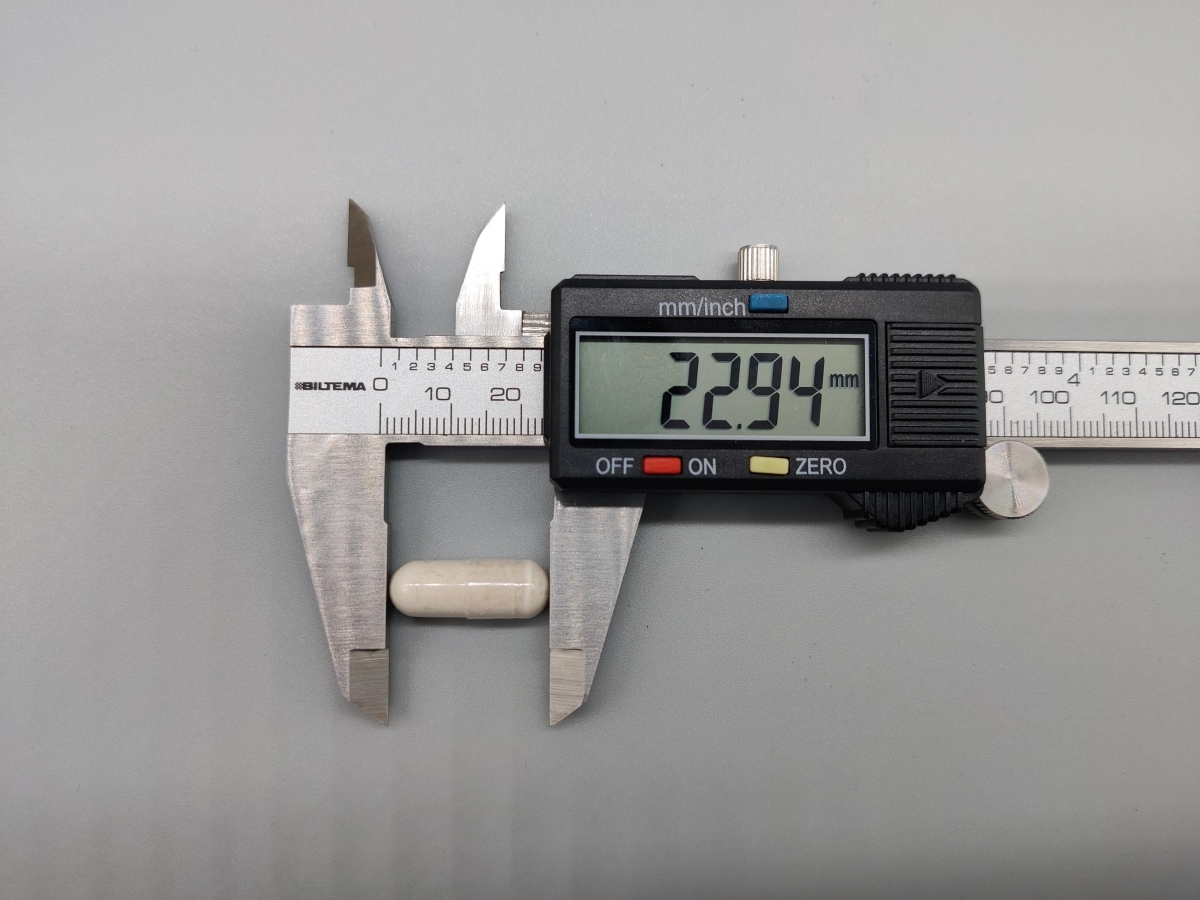 Kapselstorlek mätt av oss till 22,94 mm