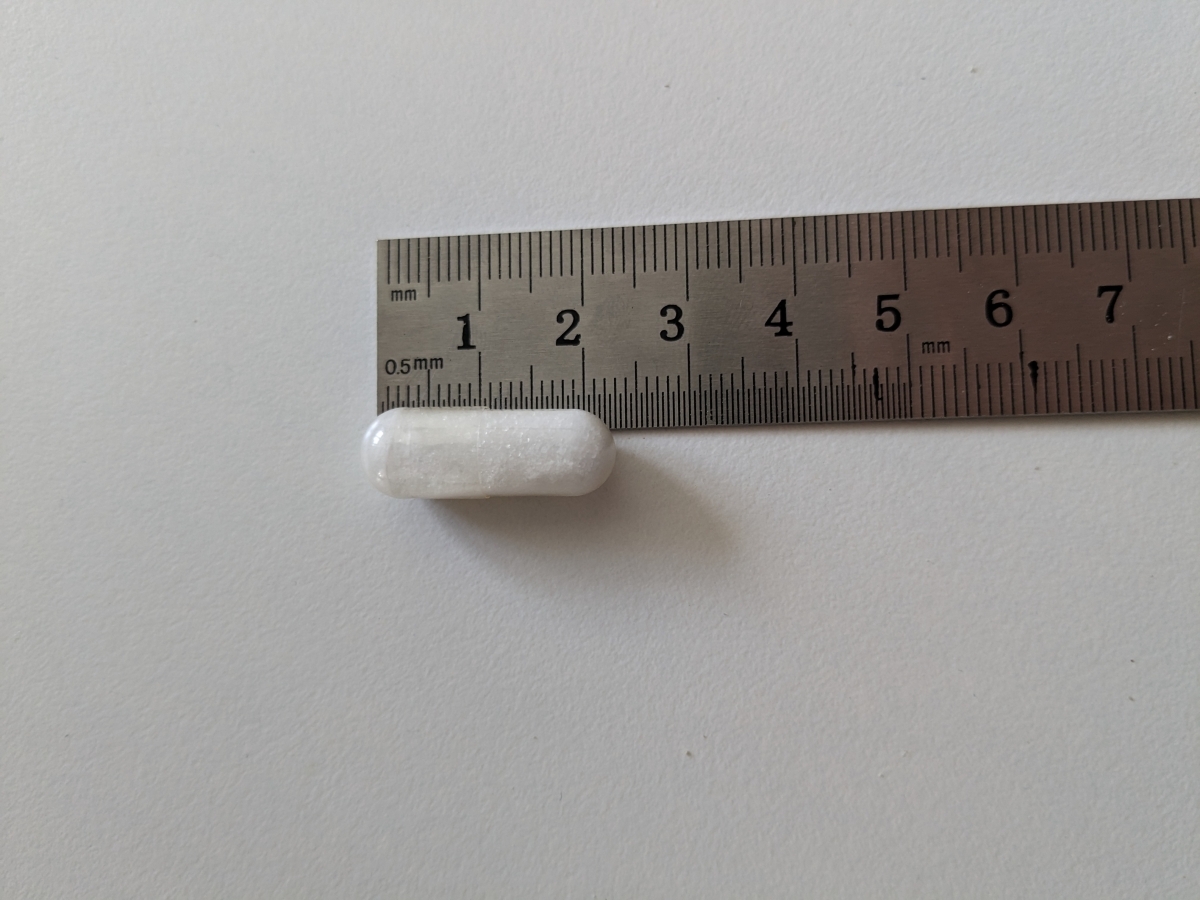 Original Silicea kapsel bredvid linjal cirka 2 cm, tagen av oss